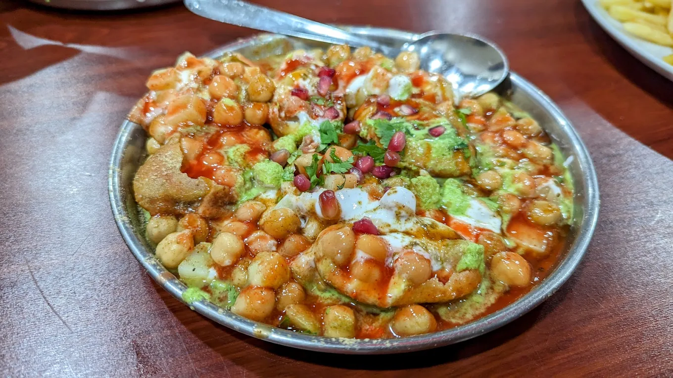 Plates of Indian chaat and street food at Rita's Chilli Chaat Corner, Southall